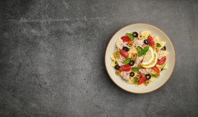 Tuna Pasta Salad on black background , top view, copy space