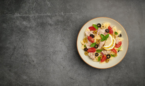Tuna Pasta Salad on black background , top view, copy space