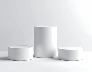 Three white cylinder pedestals on white backdrop