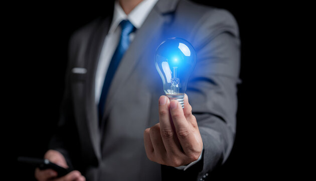 Innovation concept showing glowing light bulb with blue gears representing technology and creativity.