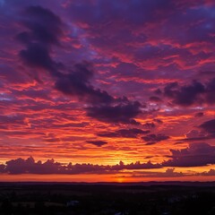 Obraz premium Dramatic sunset sky with clouds over landscape
