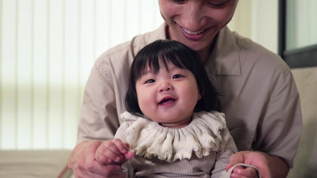 Smiling baby enjoying time with dad
