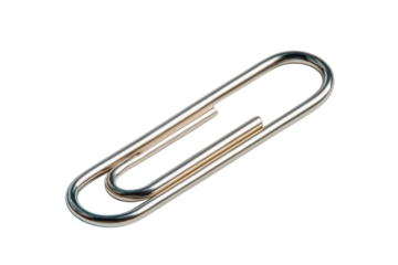 Shiny silver metal paperclip object isolated on black background studio shot image