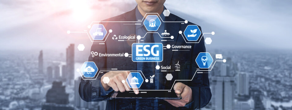 A business professional interacts with a tablet showcasing ESG strategy graphics against a city backdrop, symbolizing modern challenges in governance and sustainability. Tessel