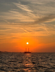 sailboat at sunset in the Adriatic Sea against sunset sky in Zadar, Croatia