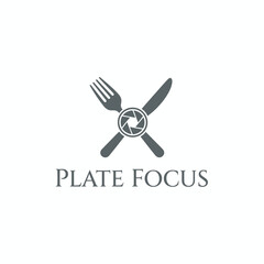 A logo featuring a fork and knife crossing, with a camera aperture in the center. Text below