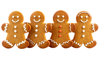 Four smiling gingerbread men cookies lined up on black