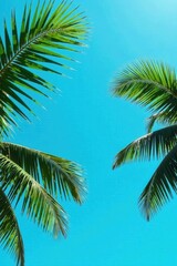 Fototapeta premium Vibrant Green Palm Fronds Against a Clear Azure Sky, a Tropical Paradise Image Perfect for Relaxation and Vacation Themes