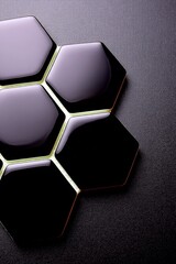 A close-up, high-angle view of several glossy black hexagonal tiles arranged in a cluster on a dark, textured background.