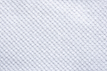  close-up of a white woven fabric, showcasing its delicate, uniform texture and subtle shadows.