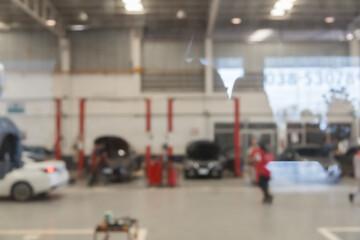 blured image of car service centre auto repair workshop