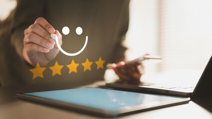 satisfaction, feedback, review, rating, Close-up of a person giving a five-star rating with a smile icon on a digital device, representing customer satisfaction and quality feedback.