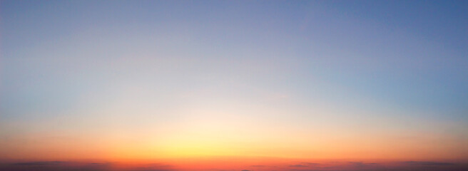 Sunset sky background. Panoramic view of sunset sky.