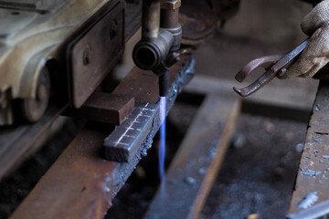 Industrial Metal Cutting with Oxy Acetylene Torch in Workshop