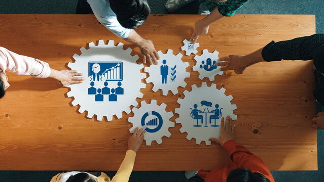 Collaborative Business Strategy Session with Hands on Gears Representing Management, Team Building, Planning, and Growth in a Corporate Environment. Amity