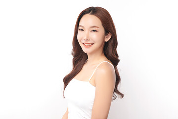 A beautiful young Asian woman with clean, fresh skin against a white background. Skincare, facial treatment, cosmetology, beauty, and spa. An elegant portrait of an Asian woman.
