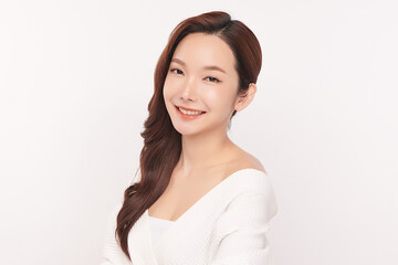 A beautiful young Asian woman with clean, fresh skin against a white background. Skincare, facial treatment, cosmetology, beauty, and spa. An elegant portrait of an Asian woman.