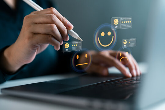 Businessperson using stylus and laptop to analyze digital customer reviews, concept of online feedback, satisfaction ratings, CRM, and reputation management for business improvement.