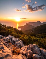 Scenic mountainous landscape during a vibrant golden sunset over the sea