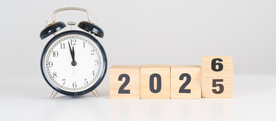 2025 end year to Happy New Year 2026 with vintage alarm clock. Christmas, New Start, Resolution, countdown, Goals, Plan, Action and Motivation Concept