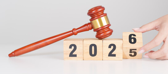 2025 end year to Happy New Year 2026 with judge gavel on table. Law, lawyer, judgment, justice...