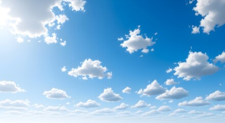 Blue sky with fluffy white clouds on a bright summer day