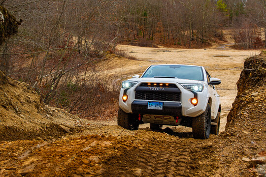 Toyota 4Runner TRD Pro Off-Road Vehicle Driving Through Muddy Terrain