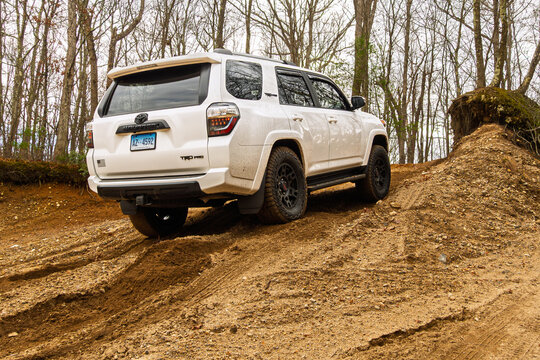 Toyota 4Runner TRD Pro Off-Road Vehicle Driving Through Muddy Terrain