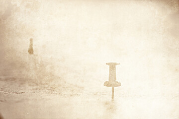 Background for travel concept. An old sheet of paper with a map silhouette with a compass and directions.