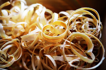 Hand planer with wooden sawdust. On a wooden background. High quality photo