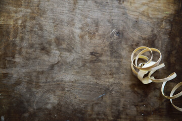 Plane jointer carpenter or joiner tool and wood shavings. Woodworking tools on wooden table. Carpentry workshop