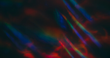 Defocused light lens. Holographic flare. Red green blue neon colorful luminosity on dark black background. Spectrum ray abstract optical effect.