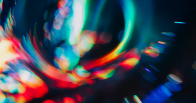 Bokeh crystal glow. Gradient reflection. Fluorescent abstract colorful circle on dark background. Blur holographic neon gleam optic effect. - Powered by Adobe