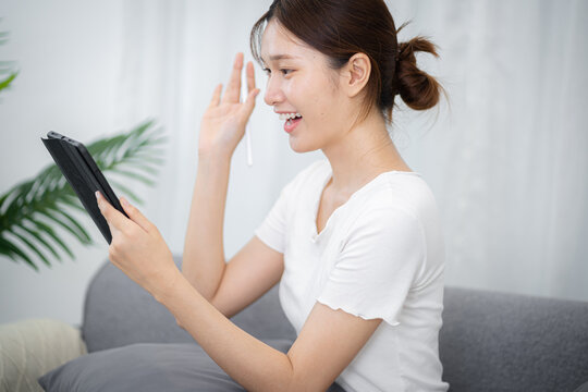 E learning Student online VDO Call Conference Work from home with cat remote work talk chat online on laptop webcam conference working with tablet social distancing concept