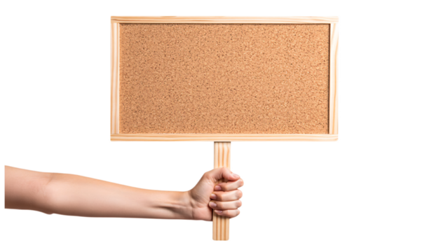 Hand holding a blank wooden framed cork notice board on a stick isolated on transparent background