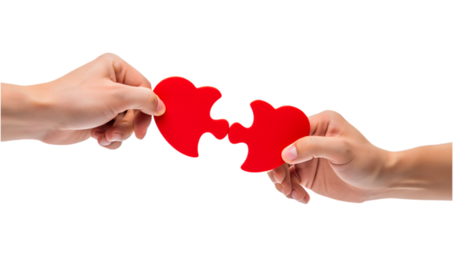 Two hands connecting red heart puzzle pieces isolated on transparent background