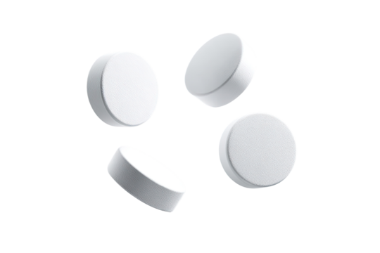 Four white, round tablets scattered