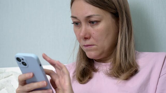 Ill woman feeling unwell using her smartphone at home to order medicine from a digital pharmacy, easily browsing and selecting prescriptions for convenient home delivery service