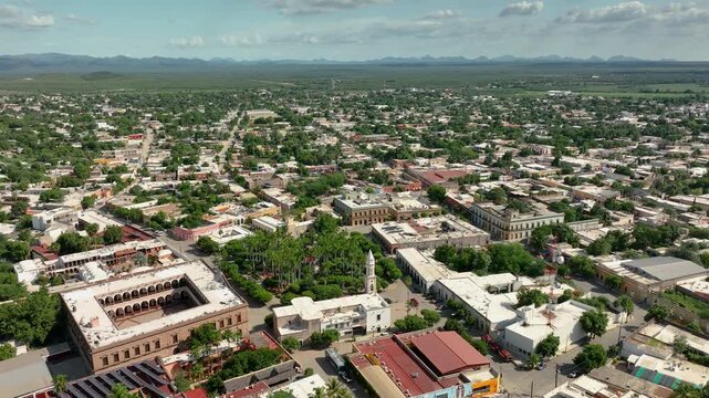 Aerial view diving over downtown El Fuerte, sunny day in Sinaloa, Mexico
