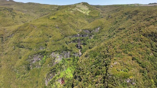 Wide drone view of Levadas Cascata do Risco in lush mountainous terrain, Madeira
