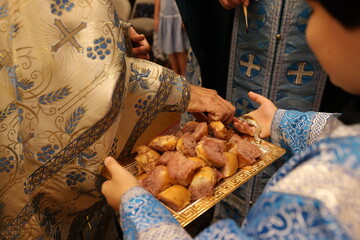 priest taking church bread