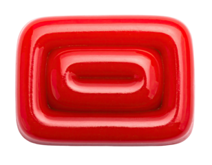 Glossy, red, rectangular object with a recessed, nested, oblong shape