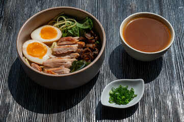 Ramen soup in a cafe. Broth separately. 