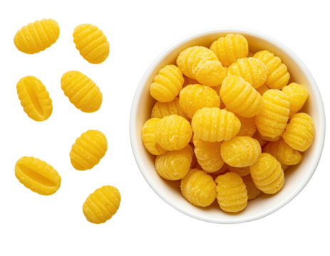 Overhead shot of uncooked, ridged potato dumplings in a bowl and scattered