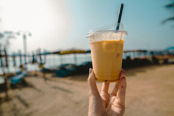 Refreshing mango drink enjoyed by the beach coastal paradise beverage photography sunny atmosphere close-up view relaxation