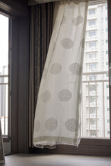 It's a curtain blowing in the wind