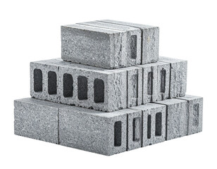 Grey concrete blocks stacked in a pyramid shape against a black background