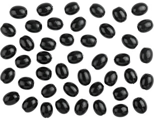 Close-up shot of a scattering of dark, glossy black olives against a black backdrop