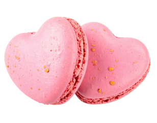 Two pink heart-shaped desserts, slightly speckled, against a transparent background