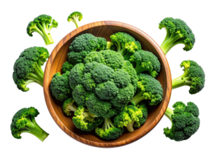 Fresh green broccoli florets spilling from a wooden bowl against a black backdrop
